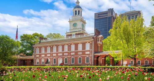 Independence Hall in Philadelphia, Pennsylvania with spring flowers blooming all around.