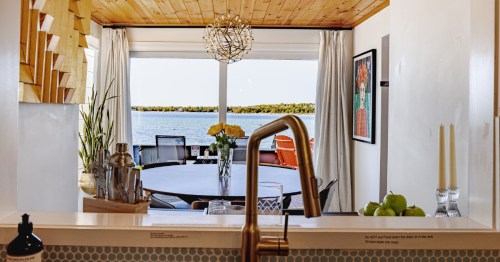 An interior view from the kitchen in this lakefront cabin Airbnb looking out toward the lake.