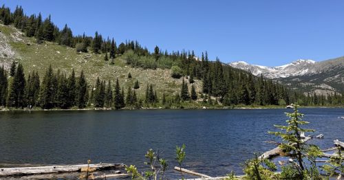 Lost Lake, an alpine lake in Colorado with the snow-capped Continental Divide looming in the distance.