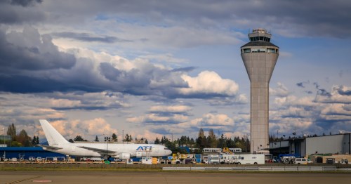 ATI cargo Boeing 767 aircraft and air traffic control tower, SeaTac Seattle, USA
