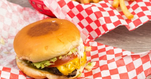 Cheeseburger Basket with Fries wrapped in red and white paper