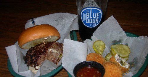 a blucy burger and spam bites and a pint of beer at blue door pub in minnesota