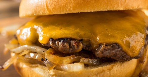 closeup of an onion burger with cheese