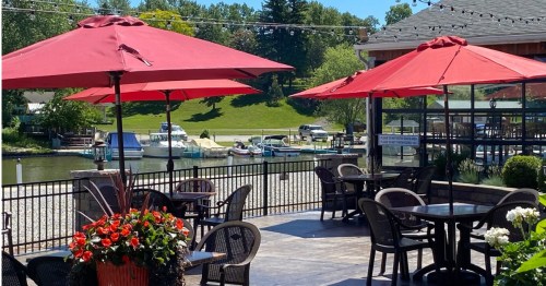 Outdoor dining patio overlooking the river at Trader Jack's in Eastlake, Ohio.