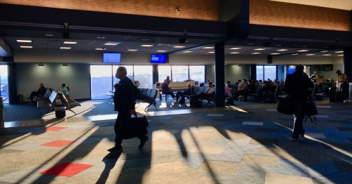 passengers wait by gates at Pittsburgh International Airport (PIT) in Pennsylvania